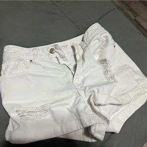 White shorts with rips